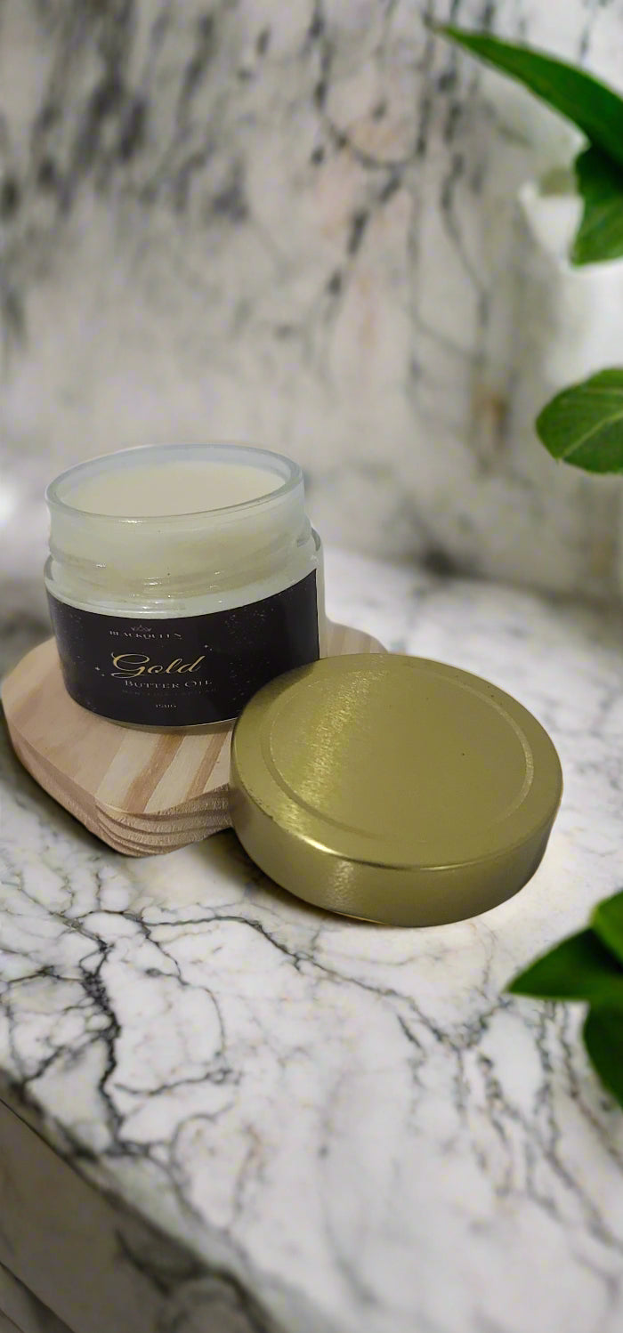 Small container with a gold lid on a white surface