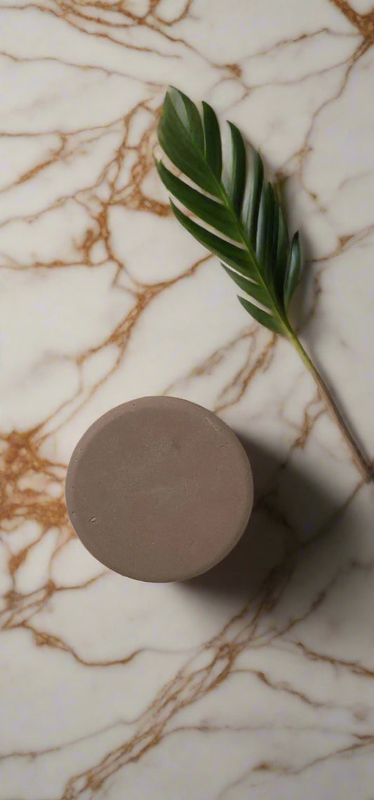 Brown cylindrical object on a white background