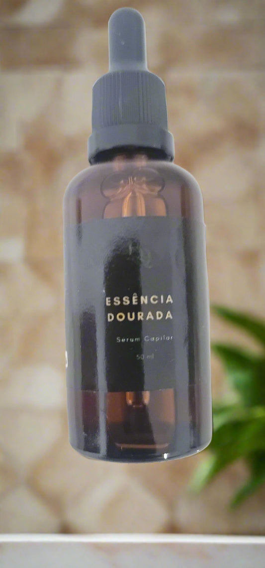 Brown bottle with dropper labeled 'Esséncia Dourada' on a white background
