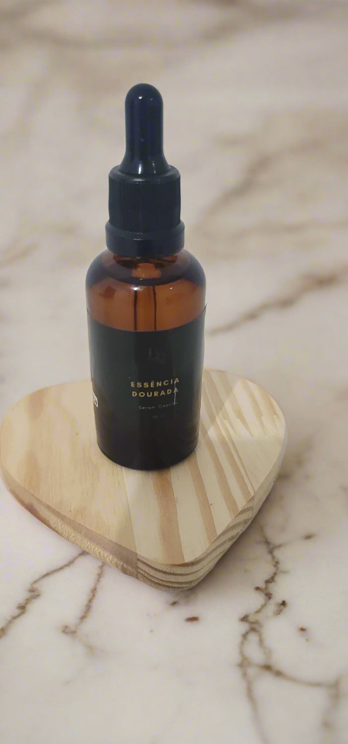 Bottle with wooden base on a white surface